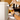 User pouring fresh beer from the iGulu F1 smart brewing machine by pulling the tap handle