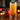 Chilled golden cider served with fresh apple garnish on a rustic wooden table