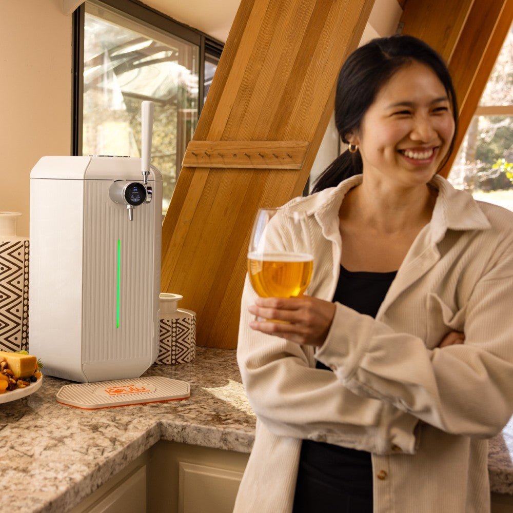 Woman drinking craft beer made with iGulu F1 brewing machine